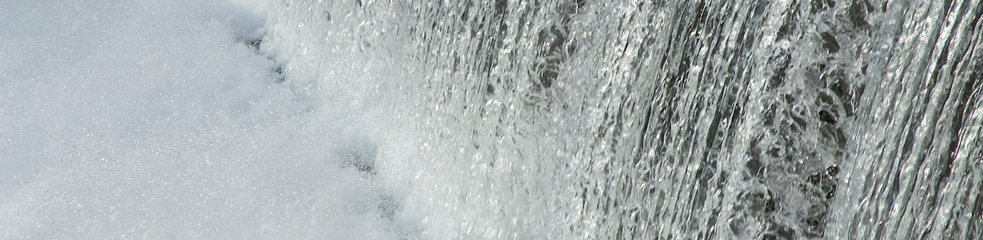 close-up of water flowing off dam
